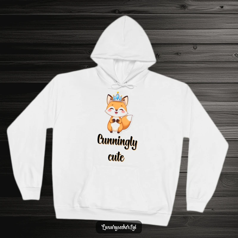 Funny Fox Tiara Hoodie: A comfortable hoodie featuring a joyful fox holding a small, sparkling tiara aloft, offering cozy and glamorous wear.