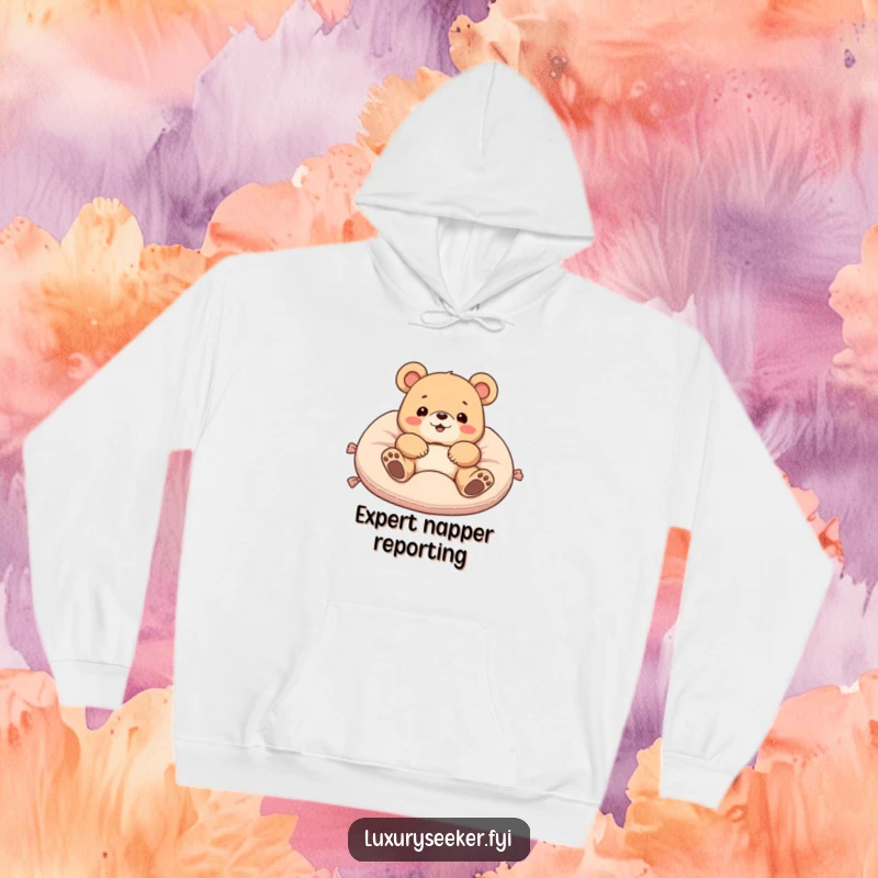 Funny hoodie depicting a delighted bear lounging extravagantly on a soft velvet cushion, showcasing supreme comfort and a humorous attitude.