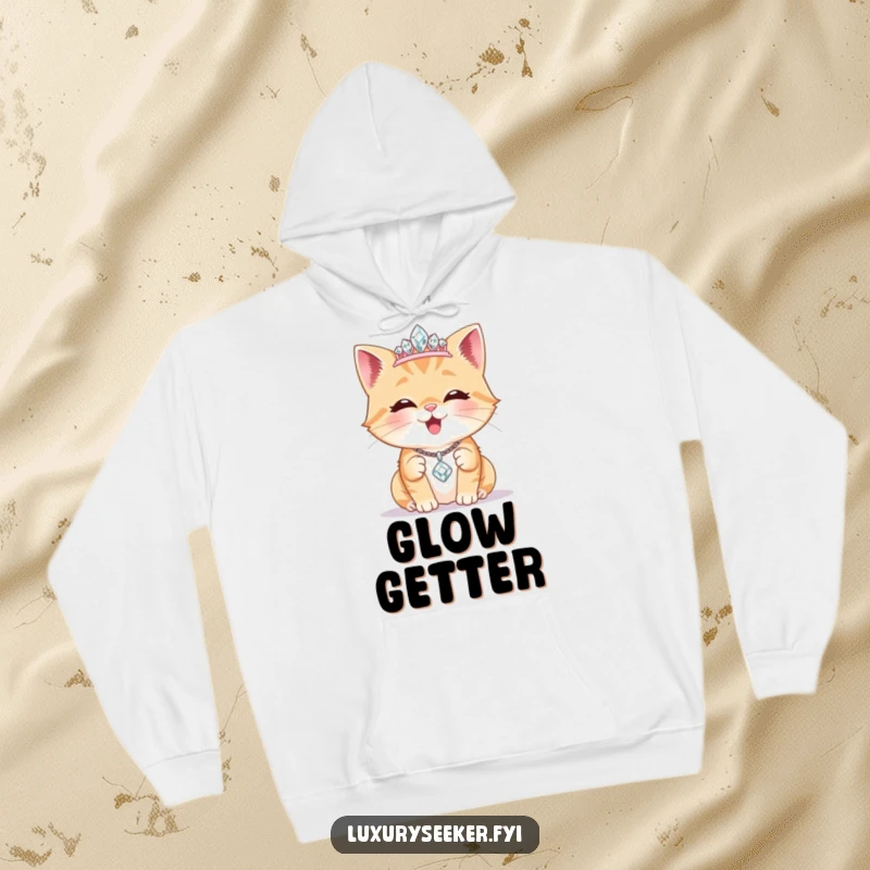 Funny Hoodie: A delighted cat wears a tiny diamond tiara, admiring a sparkling necklace, offering cozy comfort with a regal, glamorous flair.