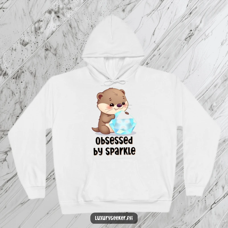 Funny otter hoodie showing a curious character mesmerized by the brilliance of a large, glistening gemstone.
