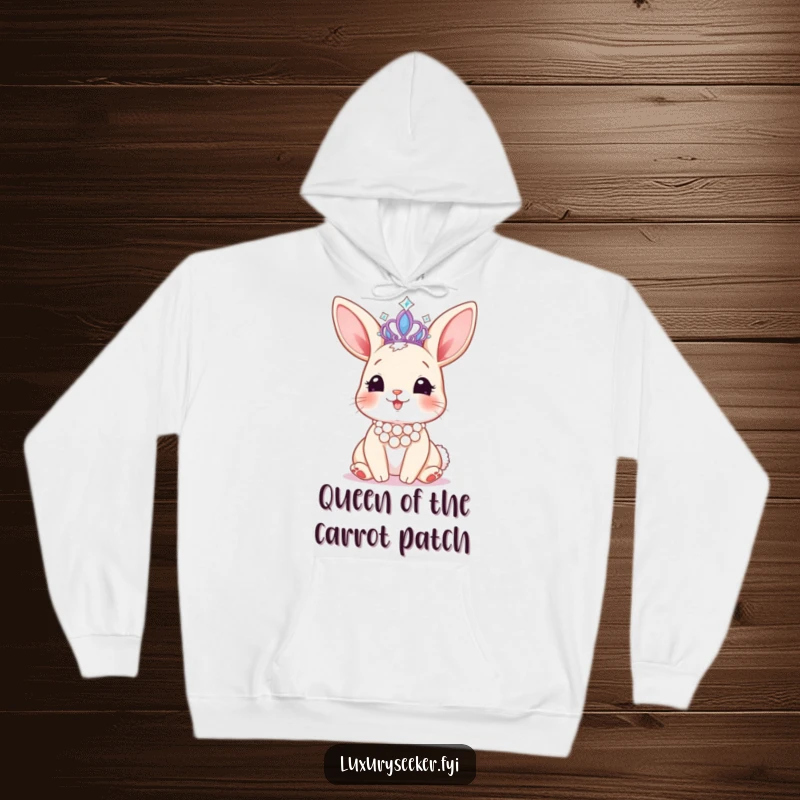 Funny hoodie featuring a happy bunny with a pearl necklace, admiring a sparkling tiara, offering cozy charm and regal vibes.