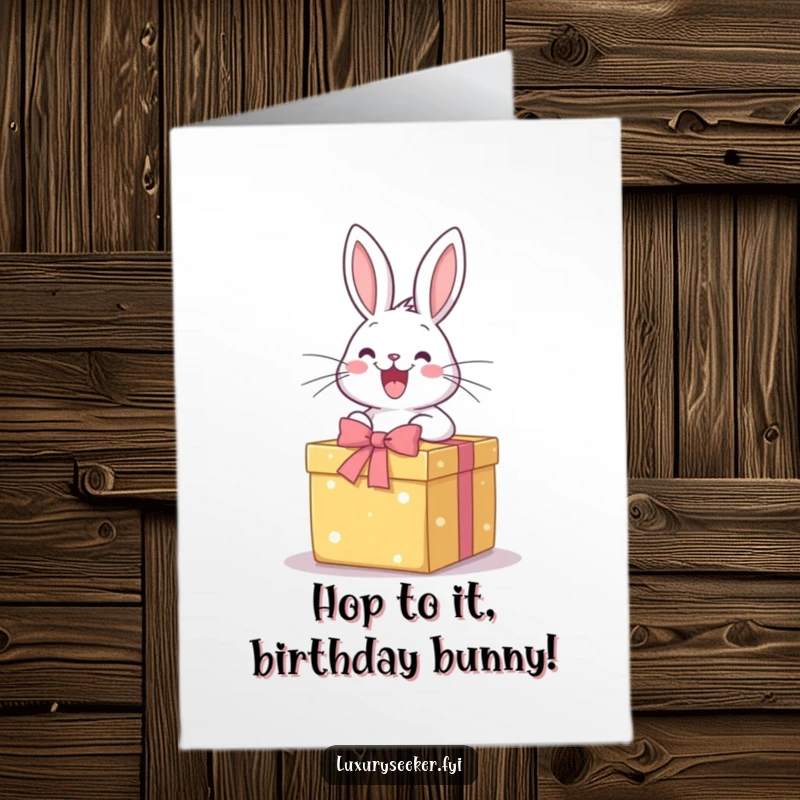 Funny Free Printable Birthday Card: Happy rabbit joyfully opens a perfectly wrapped gift box, symbolizing birthday excitement.