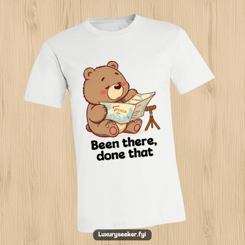 Funny t-shirt with a focused bear studying a map, marking off luxury travel destinations, showing ambition and humor.