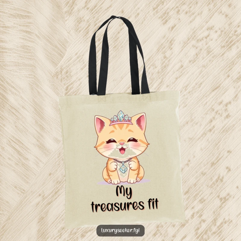 Funny Tote Bag: A delighted cat wears a tiny diamond tiara, admiring a sparkling necklace, ideal for stylish everyday carry.
