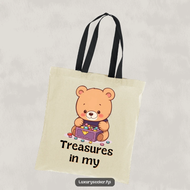 Funny Bear Tote Bag featuring a curious bear captivated by a miniature jewelry box spilling with glittering treasures, a charming accessory.